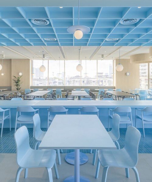 baby blue hues engulf onion's multipurpose school canteen in bangkok