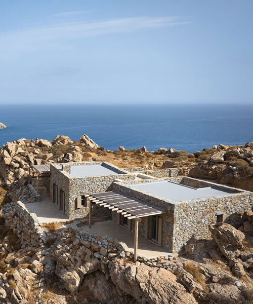 exposed stone masonry fuses restored residence by c-o lab with greek island's rocky terrain