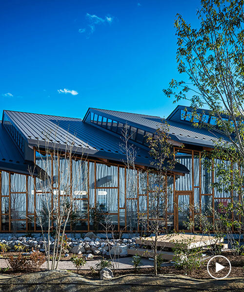 seven overlapping gabled roofs spread over haruna innovation center in japan